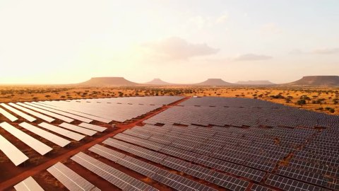 AEEG homepage hero: solar farm on the South African highveld at sunset